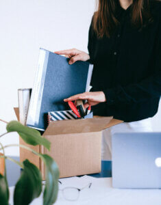 woman packing up desk